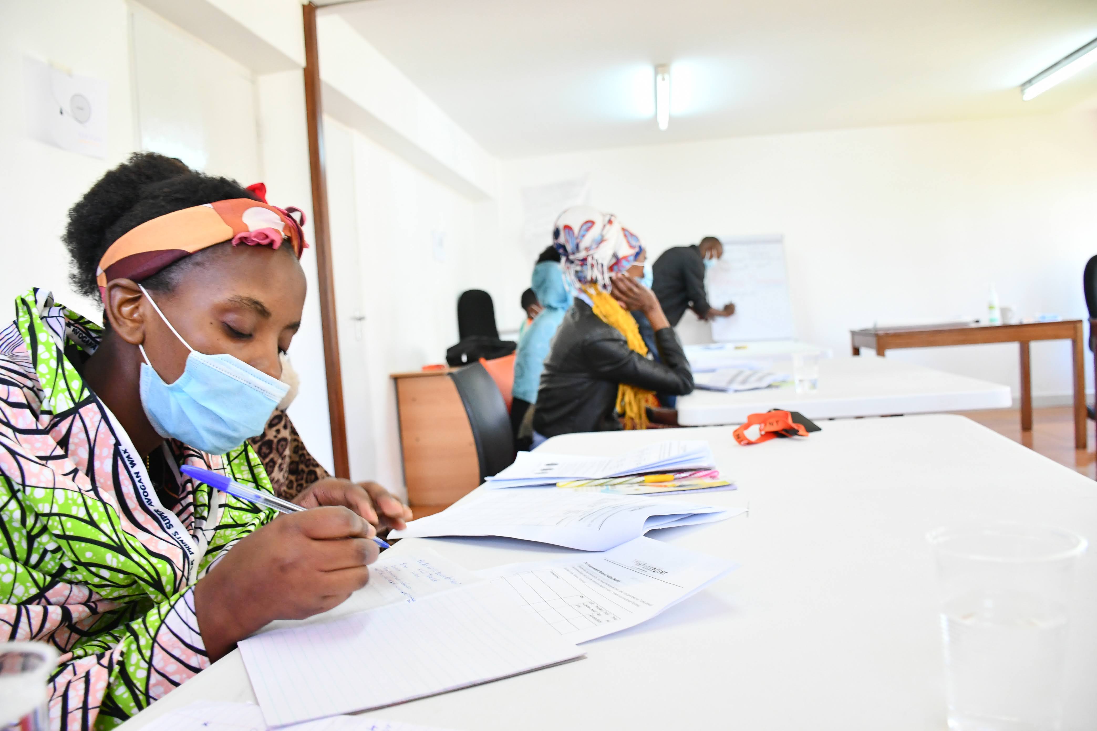 Trainees follow keenly to a session at Business Development Skills training