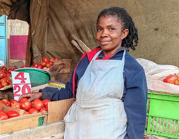 Balolwa poses next to her stall in Githurai market